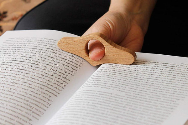 Thumb book page holder