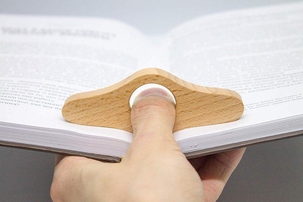 Thumb book page holder